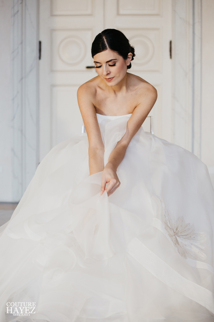 a wedding gown in organdis white and gold with a princess line